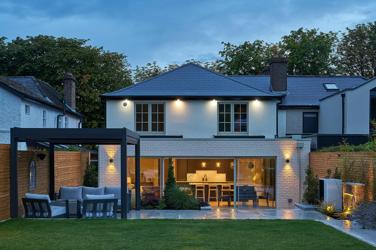 A premium Shomera house extension lit at dusk
