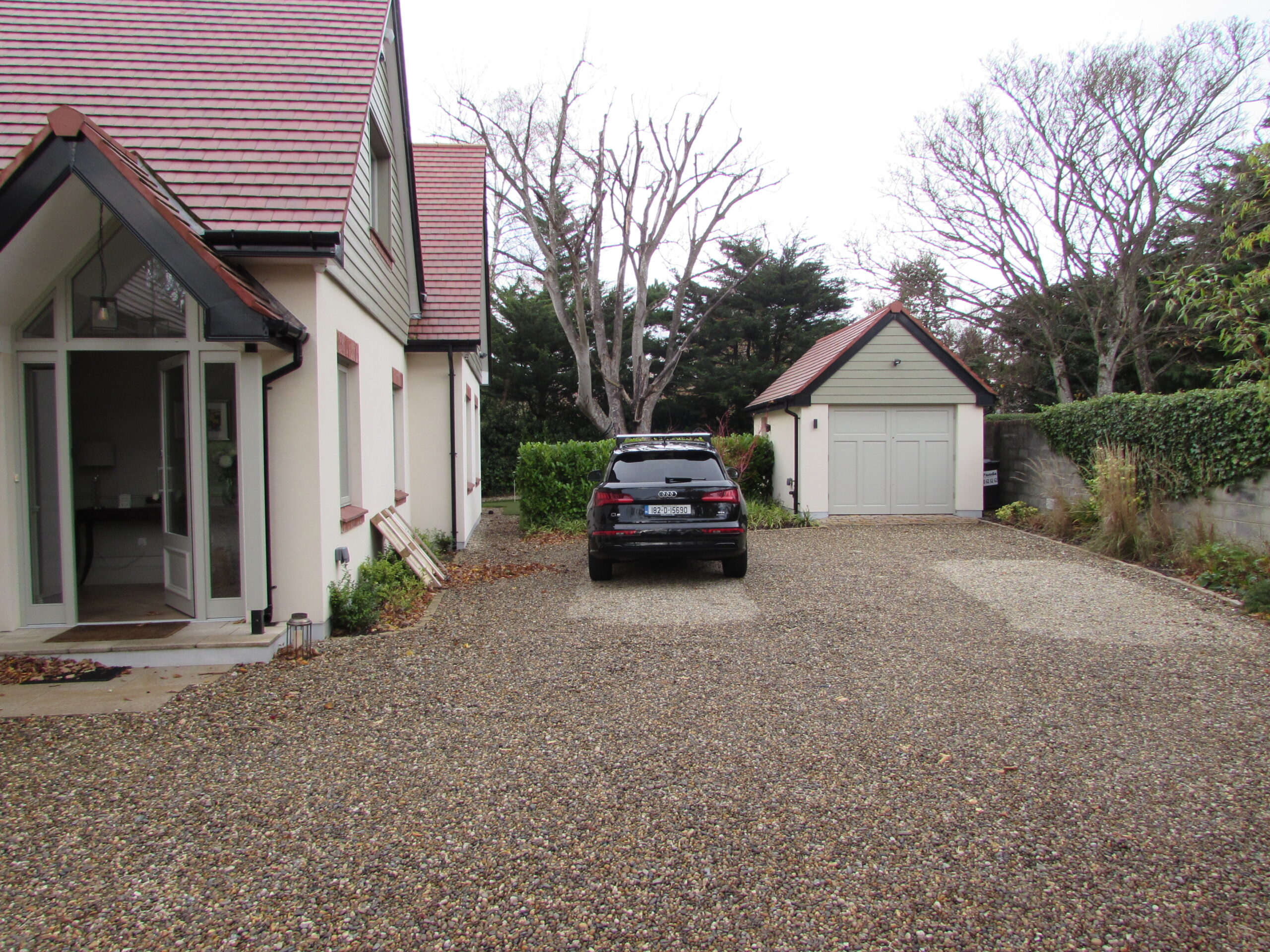 The gravel driveway looking toward the studio's position beside the house