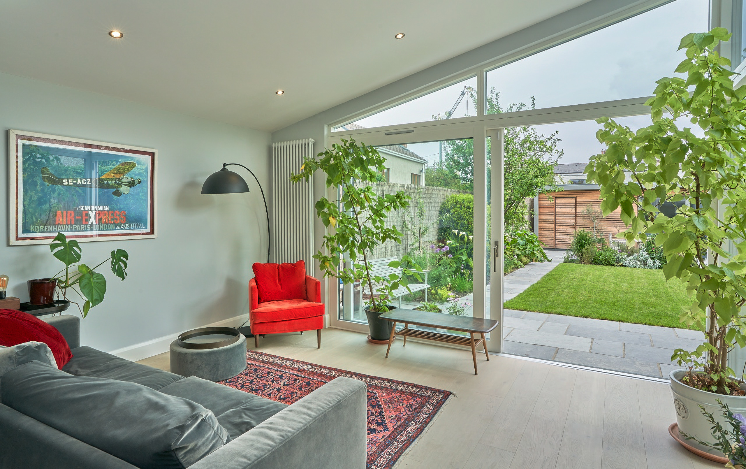 The completed rear extension, its mono-pitched ceiling and full-height glazing opening onto the garden