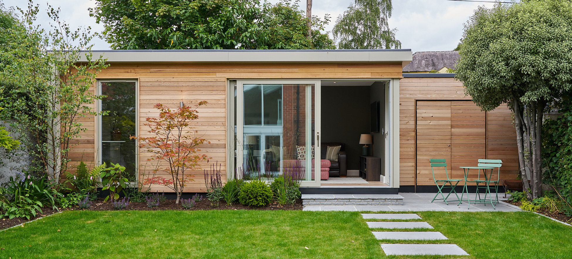 The cedar-clad Templemore Avenue studio across its landscaped garden