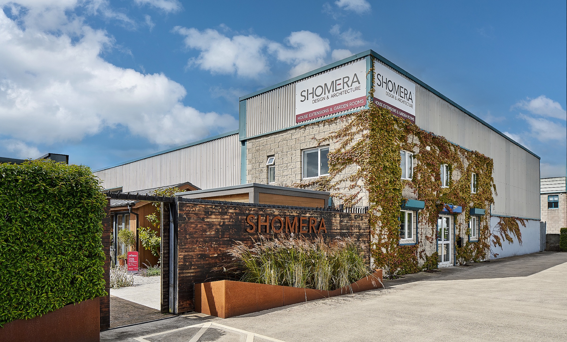 Shomera's design and build premises, with its rooftop signage and corten SHOMERA sign